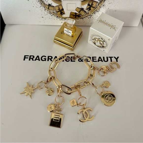 CHANEL Jewelry - Chanel authentic charm, comes with box and unbranded chain, gold, plus ribbon